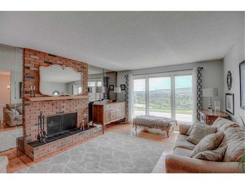 323 Silver Valley Boulevard Nw, Calgary, AB - Indoor Photo Showing Living Room With Fireplace