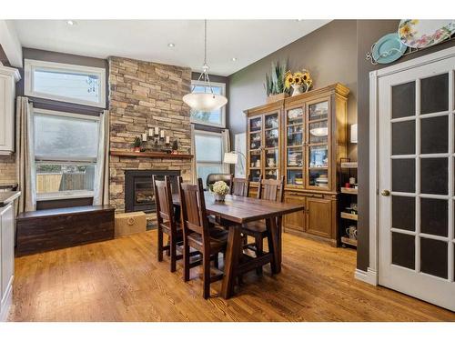 12 Lake Newell Green Se, Calgary, AB - Indoor Photo Showing Dining Room With Fireplace