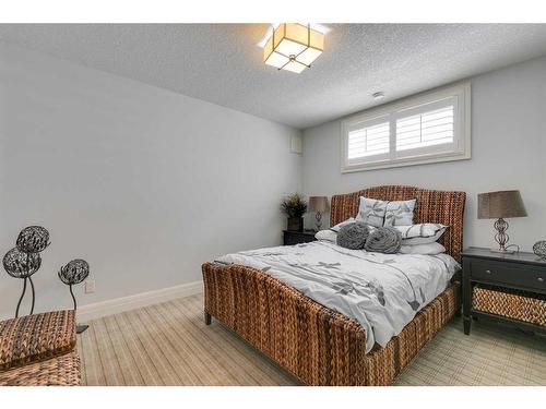 210 Fortress Bay Sw, Calgary, AB - Indoor Photo Showing Bedroom