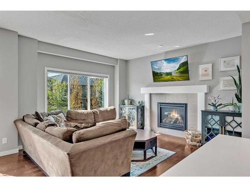 23 Evansridge Crescent Nw, Calgary, AB - Indoor Photo Showing Living Room With Fireplace