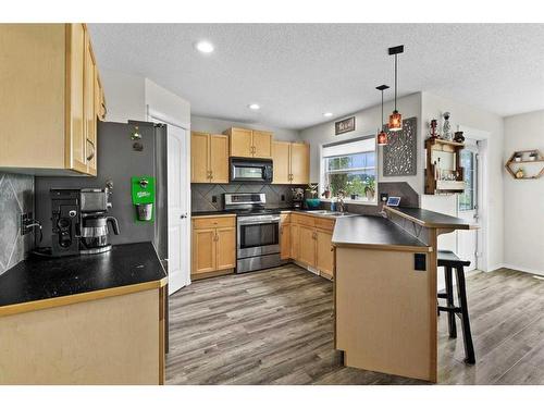 218 Sagewood Drive Sw, Airdrie, AB - Indoor Photo Showing Kitchen With Double Sink