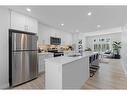 215 Les Jardins Park Se, Calgary, AB  - Indoor Photo Showing Kitchen With Stainless Steel Kitchen With Double Sink With Upgraded Kitchen 