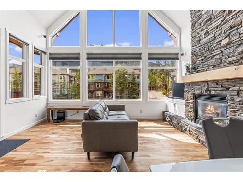 211-75 Dyrgas Gate, Canmore, AB - Indoor Photo Showing Living Room With Fireplace