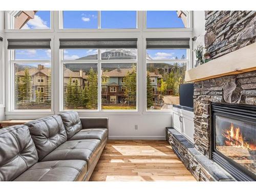 211-75 Dyrgas Gate, Canmore, AB - Indoor Photo Showing Living Room With Fireplace