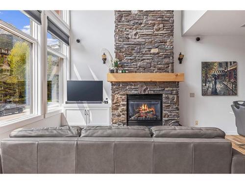 211-75 Dyrgas Gate, Canmore, AB - Indoor Photo Showing Living Room With Fireplace