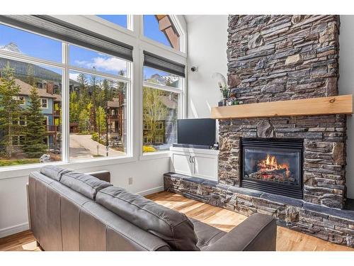 211-75 Dyrgas Gate, Canmore, AB - Indoor Photo Showing Living Room With Fireplace