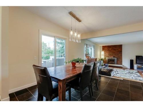 5155 Viceroy Drive Nw, Calgary, AB - Indoor Photo Showing Dining Room With Fireplace