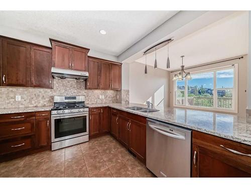 28 Val Gardena Court Sw, Calgary, AB - Indoor Photo Showing Kitchen With Double Sink