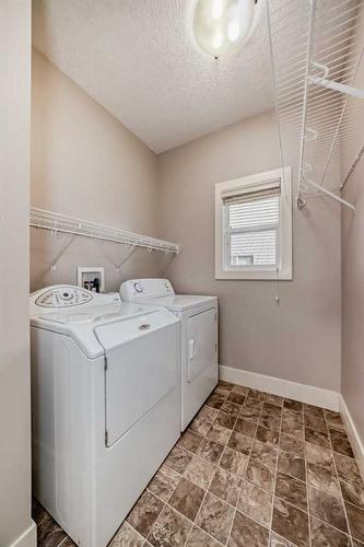 28 Val Gardena Court Sw, Calgary, AB - Indoor Photo Showing Laundry Room