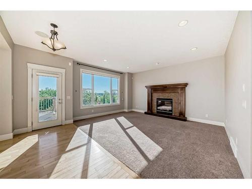 28 Val Gardena Court Sw, Calgary, AB - Indoor Photo Showing Living Room With Fireplace