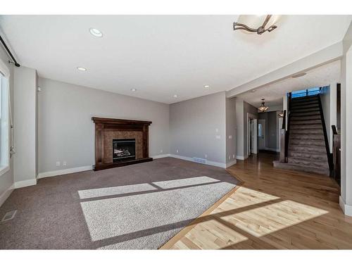 28 Val Gardena Court Sw, Calgary, AB - Indoor Photo Showing Living Room With Fireplace