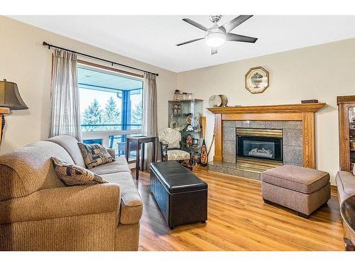 434102 64 Street West, Rural Foothills County, AB - Indoor Photo Showing Living Room With Fireplace