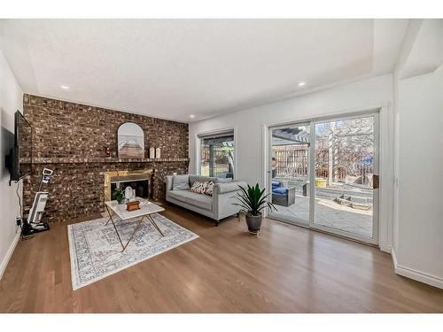 311 Edelweiss Place Nw, Calgary, AB - Indoor Photo Showing Living Room With Fireplace