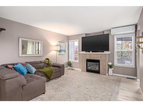 38 Autumn Green Se, Calgary, AB - Indoor Photo Showing Living Room With Fireplace