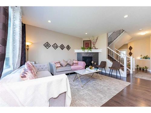 483 Cranford Drive Se, Calgary, AB - Indoor Photo Showing Living Room With Fireplace