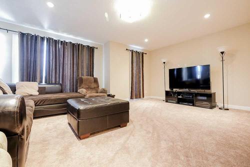 483 Cranford Drive Se, Calgary, AB - Indoor Photo Showing Living Room