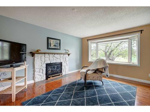 1419 Lake Ontario Road Se, Calgary, AB - Indoor Photo Showing Living Room With Fireplace