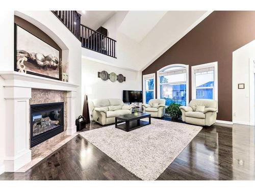 159 Evergreen Circle Sw, Calgary, AB - Indoor Photo Showing Living Room With Fireplace