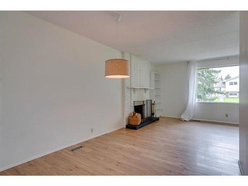 116 Silvercreek Drive Nw, Calgary, AB - Indoor With Fireplace