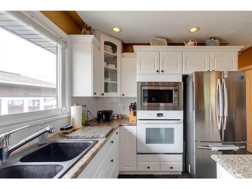 5920 Memorial Drive Ne, Calgary, AB - Indoor Photo Showing Kitchen With Double Sink