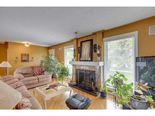 5920 Memorial Drive Ne, Calgary, AB - Indoor Photo Showing Living Room With Fireplace