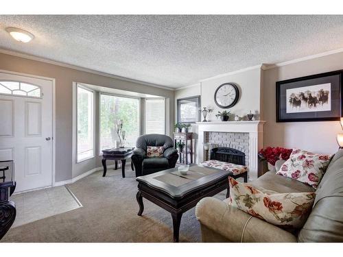 4243 Doverview Drive Se, Calgary, AB - Indoor Photo Showing Living Room With Fireplace