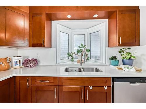 111 Shawmeadows Road Sw, Calgary, AB - Indoor Photo Showing Kitchen With Double Sink