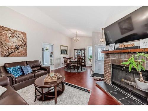 111 Shawmeadows Road Sw, Calgary, AB - Indoor Photo Showing Living Room With Fireplace