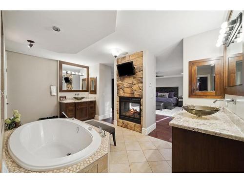 11 Aspen Ridge Gate Sw, Calgary, AB - Indoor Photo Showing Bathroom With Fireplace