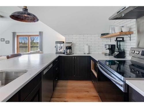 84 Eagle Butte Ranch, Rural Rocky View County, AB - Indoor Photo Showing Kitchen With Double Sink