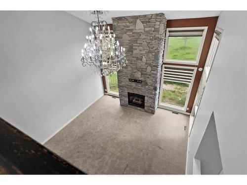 283129 Township Road 250, Rural Rocky View County, AB - Indoor Photo Showing Other Room With Fireplace