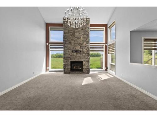 283129 Township Road 250, Rural Rocky View County, AB - Indoor With Fireplace