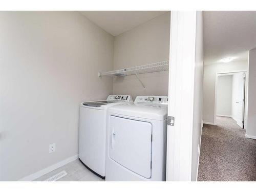 122 Cornerbrook Manor Ne, Calgary, AB - Indoor Photo Showing Laundry Room