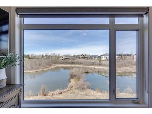 24 Royal Elm Green Nw, Calgary, AB - Indoor Photo Showing Other Room With Body Of Water