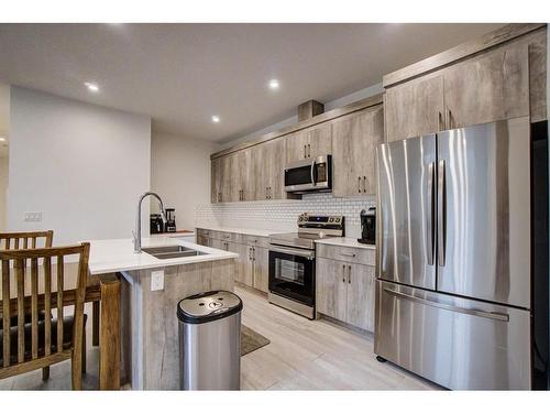 79 Harvest Square, Claresholm, AB - Indoor Photo Showing Kitchen With Double Sink