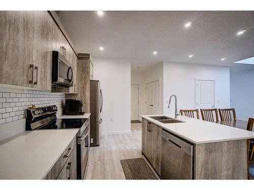 79 Harvest Square, Claresholm, AB - Indoor Photo Showing Kitchen With Double Sink With Upgraded Kitchen