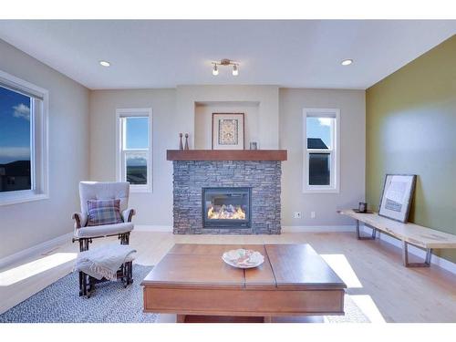 168 Heritage Boulevard, Cochrane, AB - Indoor Photo Showing Living Room With Fireplace