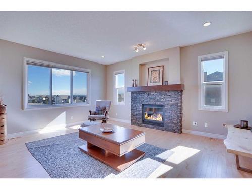 168 Heritage Boulevard, Cochrane, AB - Indoor Photo Showing Living Room With Fireplace