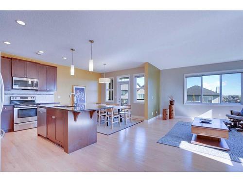 168 Heritage Boulevard, Cochrane, AB - Indoor Photo Showing Kitchen With Stainless Steel Kitchen