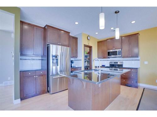 168 Heritage Boulevard, Cochrane, AB - Indoor Photo Showing Kitchen With Stainless Steel Kitchen With Upgraded Kitchen