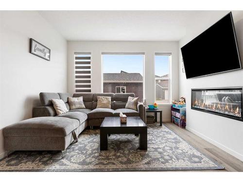 388 Lucas Boulevard Nw, Calgary, AB - Indoor Photo Showing Living Room With Fireplace
