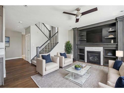 1471 Ranch Road, Carstairs, AB - Indoor Photo Showing Living Room With Fireplace