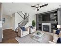 1471 Ranch Road, Carstairs, AB  - Indoor Photo Showing Living Room With Fireplace 