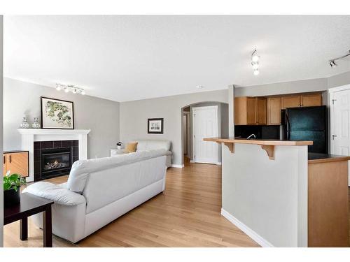 65 Everwoods Close Sw, Calgary, AB - Indoor Photo Showing Kitchen With Fireplace