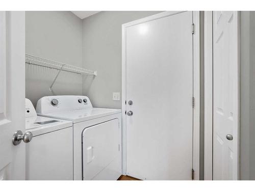 65 Everwoods Close Sw, Calgary, AB - Indoor Photo Showing Laundry Room