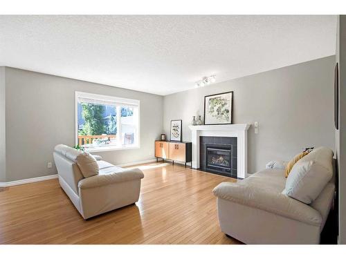 65 Everwoods Close Sw, Calgary, AB - Indoor Photo Showing Living Room With Fireplace