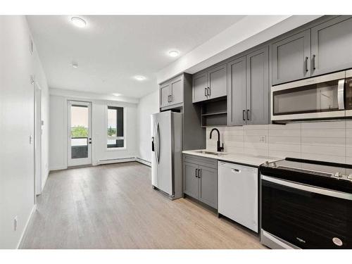 320-3932 University Avenue Nw, Calgary, AB - Indoor Photo Showing Kitchen With Stainless Steel Kitchen With Double Sink With Upgraded Kitchen