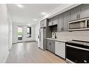 320-3932 University Avenue Nw, Calgary, AB  - Indoor Photo Showing Kitchen With Stainless Steel Kitchen With Double Sink With Upgraded Kitchen 