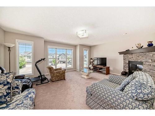 248 Panatella Cape Nw, Calgary, AB - Indoor Photo Showing Living Room With Fireplace
