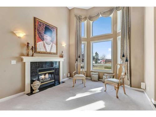 658 East Chestermere Drive, Chestermere, AB - Indoor Photo Showing Living Room With Fireplace